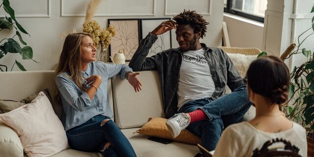 couple-talking-to-therapist couple in therapy session